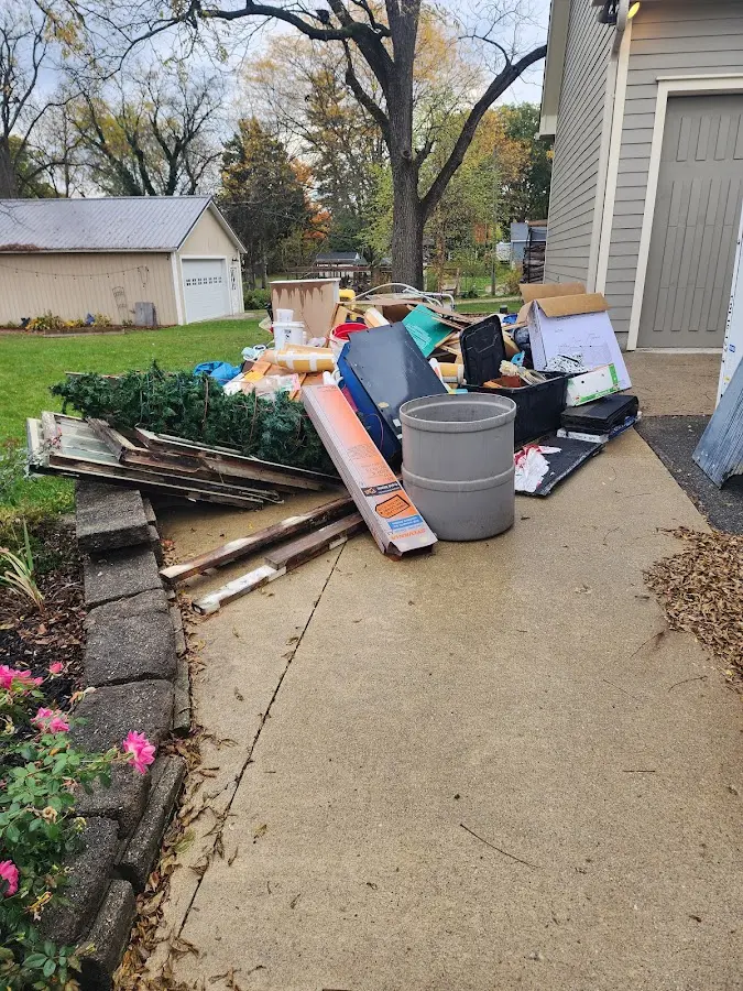 Dumpster being loaded with debris for Roofing Dumpster Rental in Fillmore
